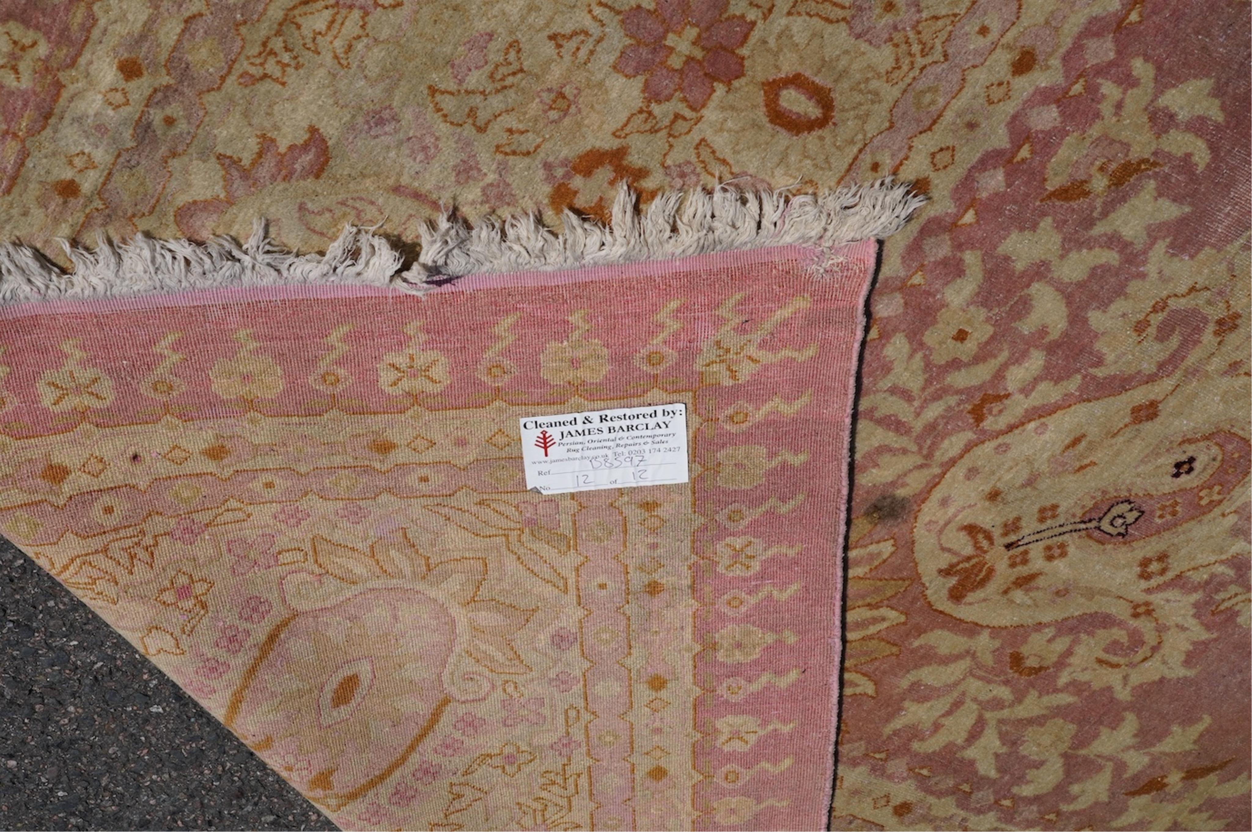 An Amritsar carpet, approximately 580 x 395cm. Condition - poor